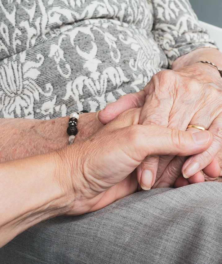 home care senior caregiver nurse helping elderly at home